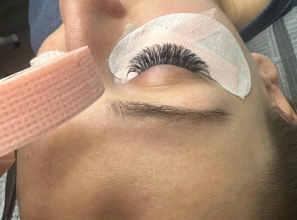 Sensitive tape for eyelash extensions, designed for delicate skin to secure lower lashes during application, providing gentle adhesion and reducing irritation.