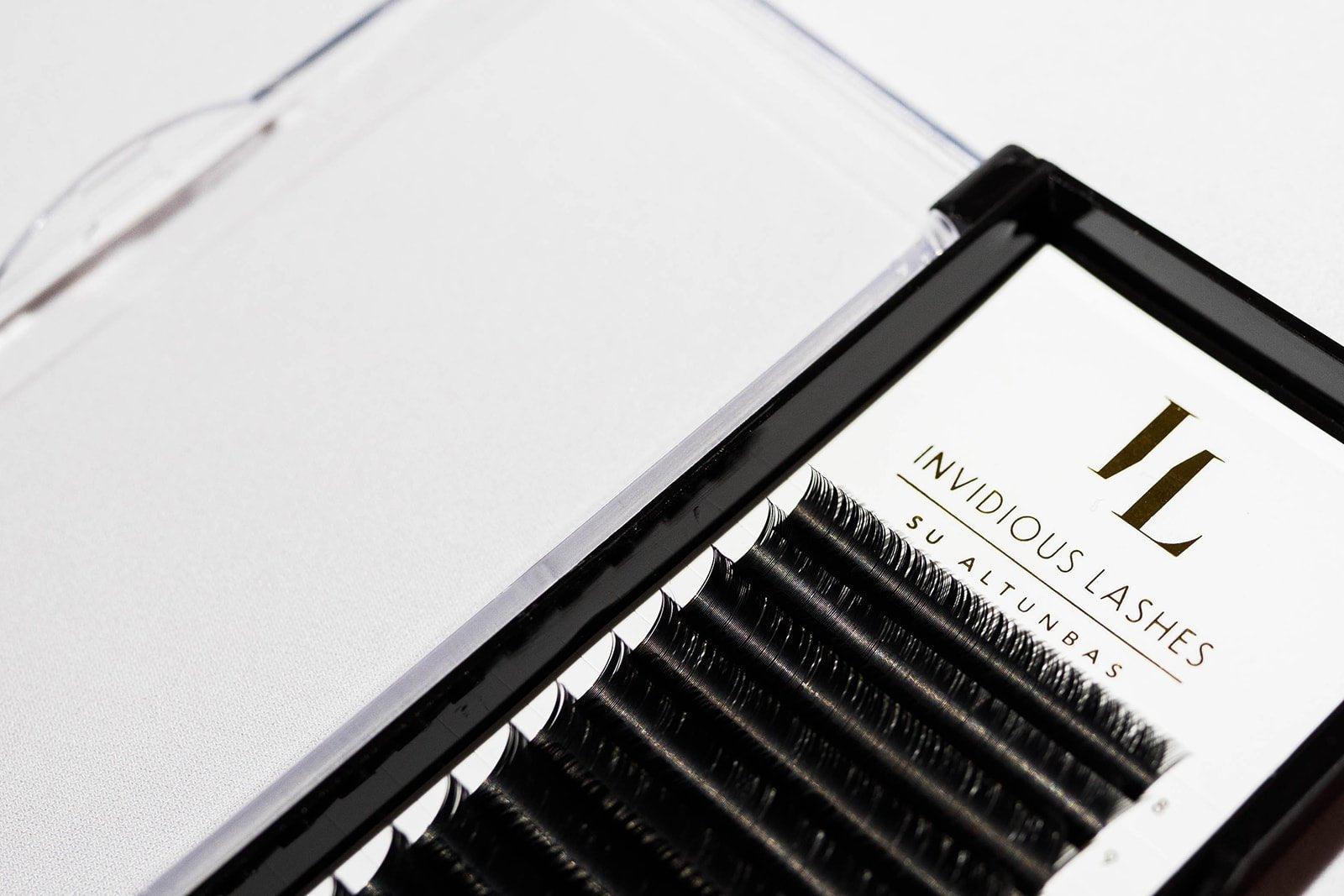 Tray of Classic Eyelash Extensions in Mixed Lengths from 8-15mm, B Curl, 0.15mm thickness, showcasing a variety of individual lashes for versatile and natural-looking lash enhancements.