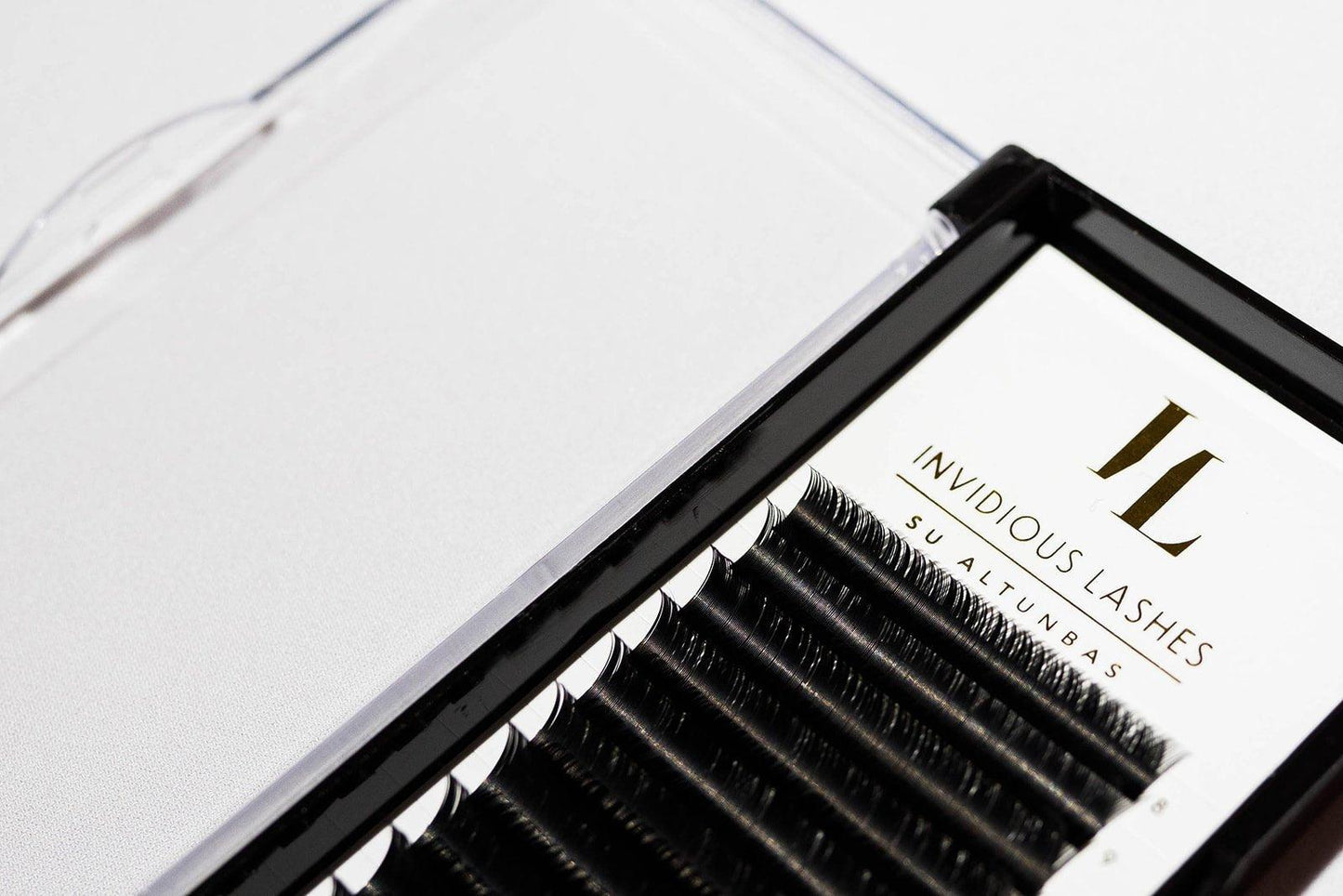 Tray of Classic Eyelash Extensions in Mixed Lengths from 8-15mm, C Curl, 0.15mm thickness, featuring a variety of individual lashes for creating natural, enhanced lash looks with a consistent curl.